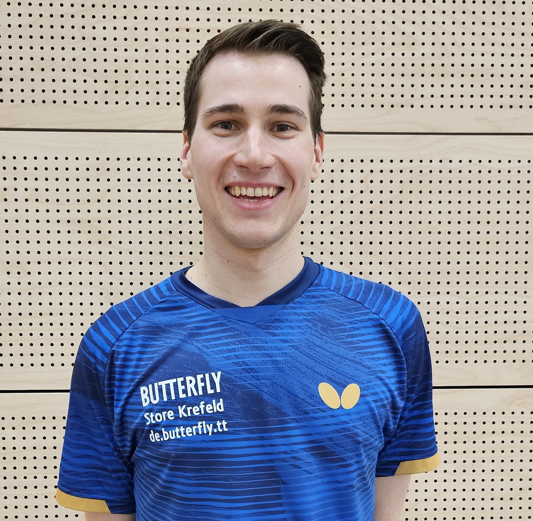 Default placeholder fitness trainer in a T-shirt.